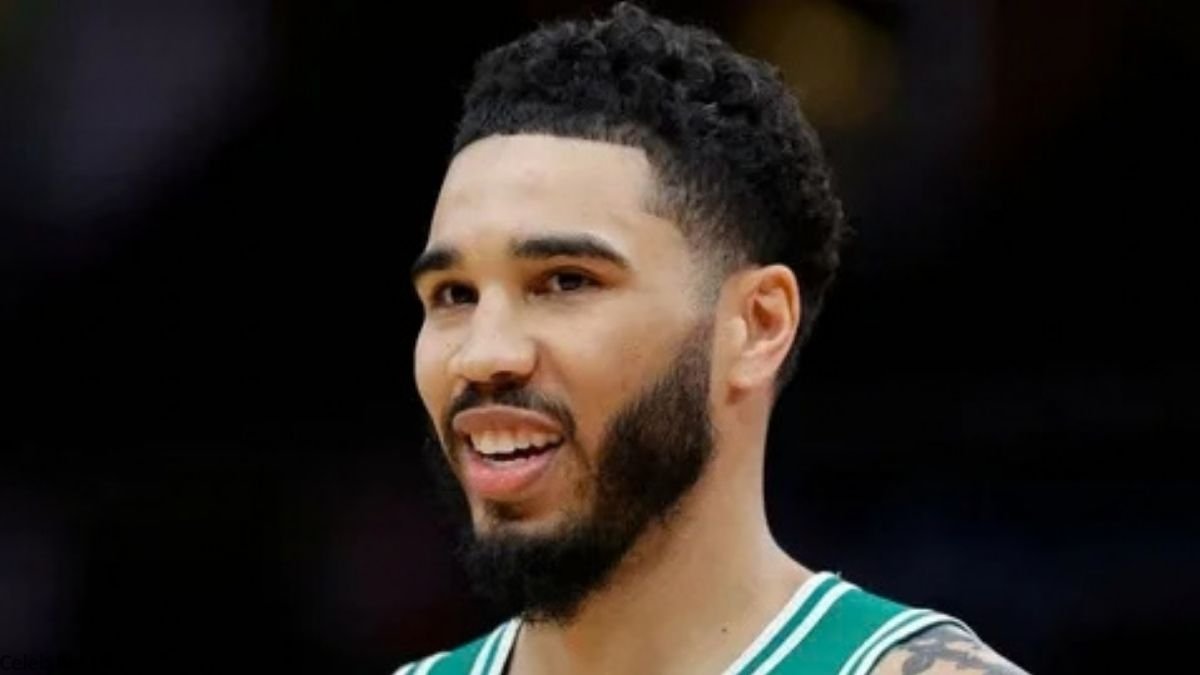Jayson Tatum smiling in Celtics jersey