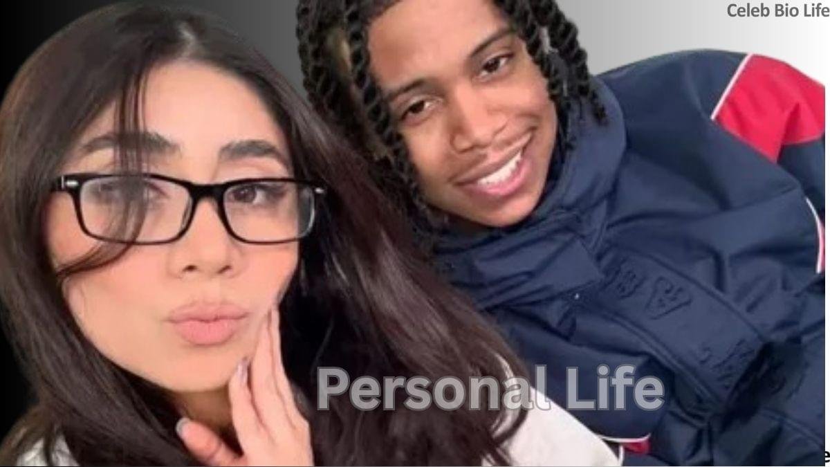 Young couple posing together for a casual selfie, smiling at the camera.